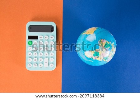 calculator and globe. global costs