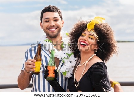 Carnaval in Brasil, happy couple enjoying brazilian party in costume