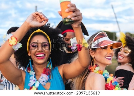 Carnaval Party in Brazil, brazilian black woman celebrating street festival in costume Royalty-Free Stock Photo #2097135619