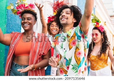 People in costume celebrates Carnival in Brazil. Group of friends have fun in brazilian holiday party. Royalty-Free Stock Photo #2097135646