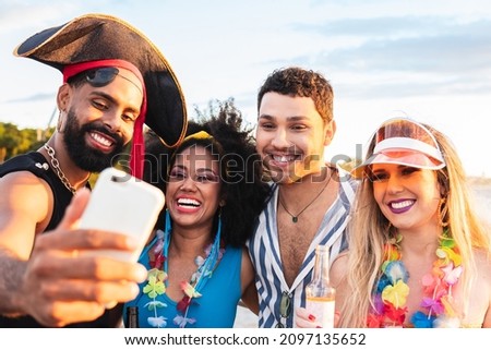 Carnaval in Brasil, happy friends together take selfie at brazilian party in costume