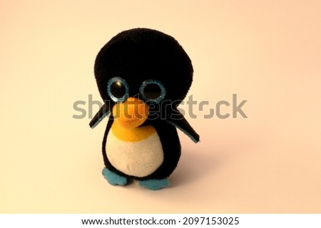 A tiny penguin toy. Close up and isolated on a white background. 