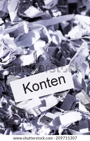shredded paper tagged with accounts, symbol photo for finance, secret accounts and double entry bookkeeping