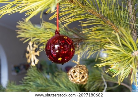 Selective shot of decorations, toys and lights on decorated christmas tree. Selective focus. Blurred