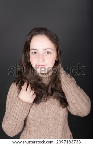portrait of a teenage girl on a black background