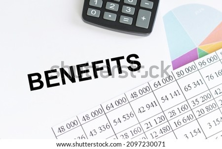 benefits text on notepad next to reports and calculator, business concept