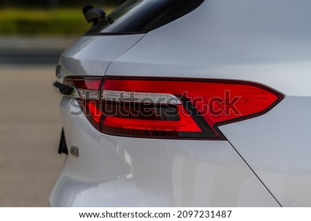 Modern rear light of a car. Brake light and arrow of large suv. Rear light of car close up view. Tail light.