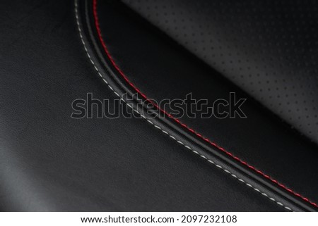 High angle view of modern car fabric seats. Close-up car seat texture and interior details. Detailed image of a car pleats stitch work. Leather seats. Royalty-Free Stock Photo #2097232108