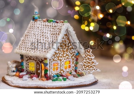 This beautiful gingerbread house is decorated with colorful sweets.  New Year's and Christmas.  Happy holidays