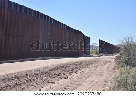Border wall construction on the USA Mexico border in the Sonoran Desert in Arizona Royalty-Free Stock Photo #2097257680