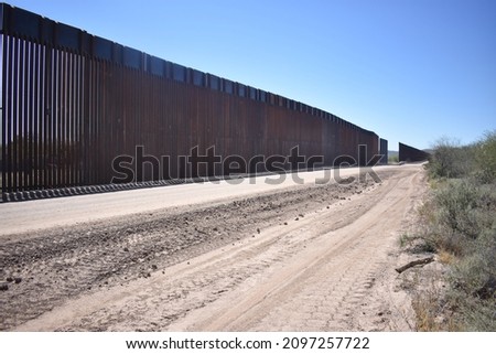 Border wall construction on the USA Mexico border in the Sonoran Desert in Arizona Royalty-Free Stock Photo #2097257722