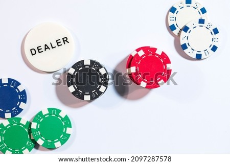 Poker playing cards with chips to bet.