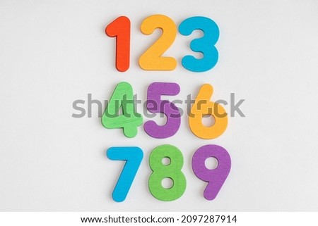0, 1, 2, 3, 4, 5, 6, 7, 8, 9 numeral alphabet. digits from wooden material, colorful toys for kids. font for logo, Poster, Invitation, children's books. numbers arranged in 3 rows. Royalty-Free Stock Photo #2097287914