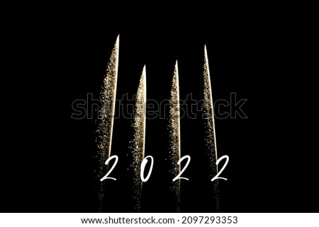 Happy new year 2022 yellow fireworks rockets new years eve. Luxury firework event sky show turn of the year celebration. Holidays season party time. Premium entertainment nightlife background