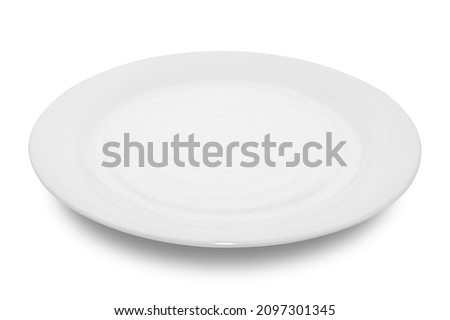 Empty white circle ceramics plate isolated on white background with clipping path.