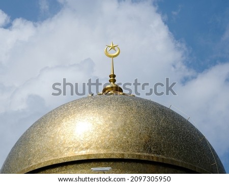 Close up with noise picture of new golden dome mosque during  in Mersing, Johor with beautiful cloud insight.