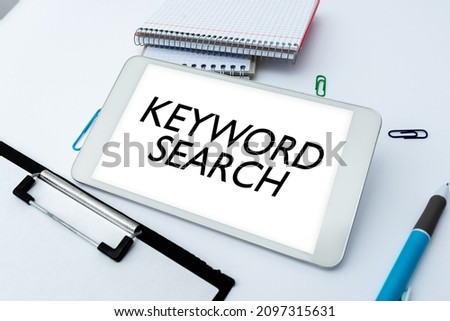 Hand writing sign Keyword Search. Word Written on Using word or term to look correct subject associated to it Smartphone With Voice And Video Calls Device For Long Range Connections