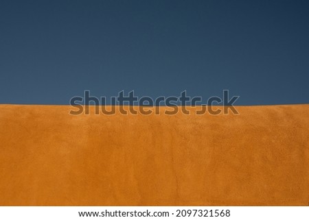 Edge of Stucco Roof on Clear Blue Sky with copy space