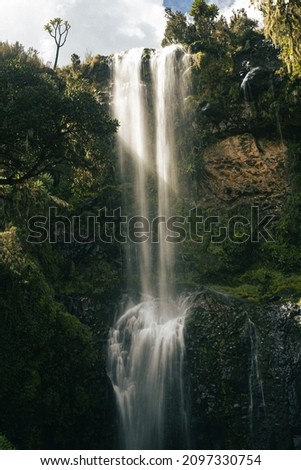 A vertical shot of the beautiful waterfall 