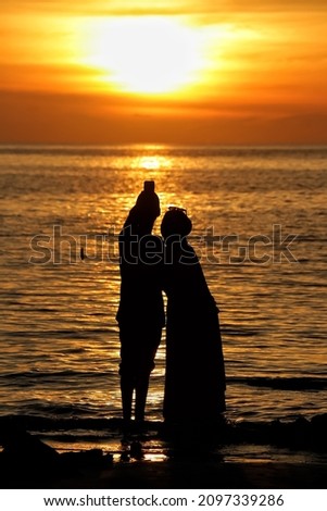 couple in love. a couple taking pictures while on vacation at the beach