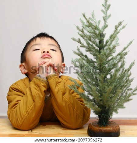 Boy in the picture with Chris Pine Tree 