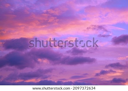  Purple orange pink sunset. Beautiful evening sky with clouds background for design.                               Royalty-Free Stock Photo #2097372634