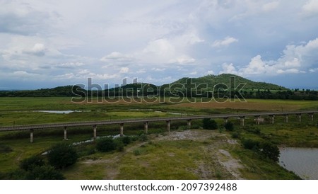 Aerial photograph of this Elevated Railway, Mountains, and Farms in Thailand