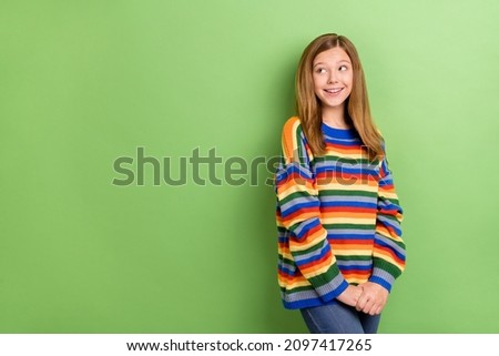 Portrait of attractive girly minded cheerful girl thinking copy space solution dream isolated over bright green color background
