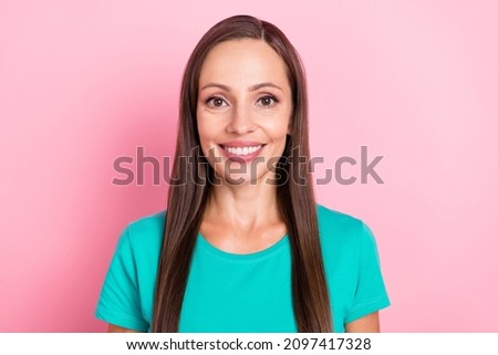 Photo of lovely cheerful positive lady shiny beaming smile wear turquoise t-shirt isolated pink color background