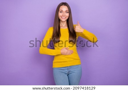 Photo of young cheerful woman hand on belly show thumb-up comfort diet good isolated over purple color background Royalty-Free Stock Photo #2097418129