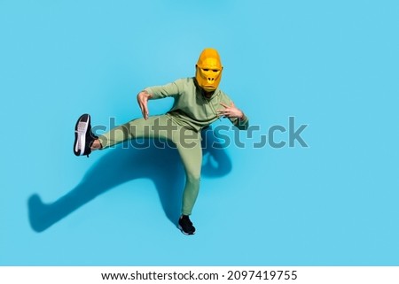 Photo of funny carefree crazy guy dance move have fun enjoy event wear gorilla mask isolated blue color background