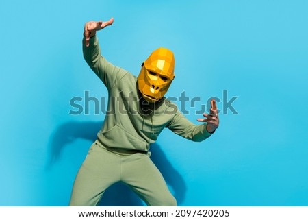 Photo of entertainer funky ape baboon dance have fun wear sportswear gorilla mask isolated blue color background