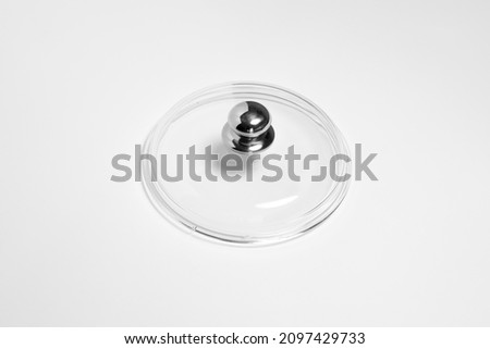 Glass lid from a pan isolated on white background.High resolution photo.Top view. Mock-up.