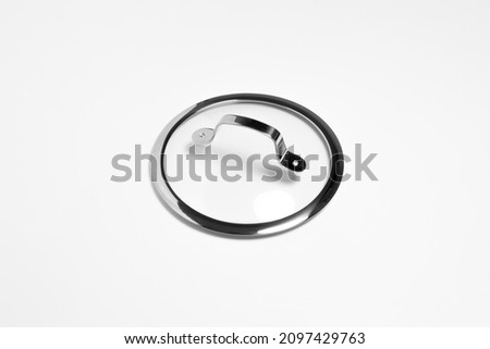 Glass lid from a pan isolated on white background.High resolution photo.Top view. Mock-up.