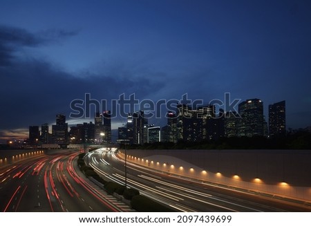 Singapore Skyline and Business District (Shenton way) and Marina coastal expressway (MCE) at rush hour Royalty-Free Stock Photo #2097439699