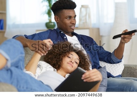 happy couple on a sofa