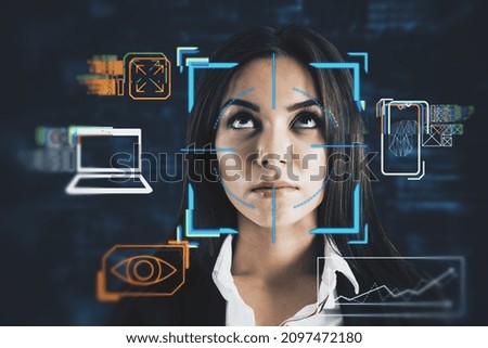 Portrait of attractive young european business woman with abstract glowing face recognition interface. Technology and security concept. Double exposure