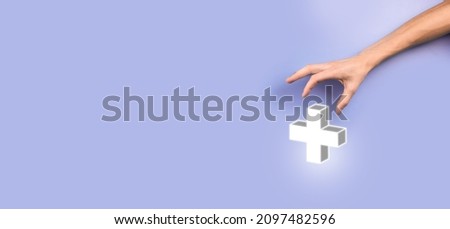 Businessman, man hold in hand offer positive thing such as profit, benefits, development, CSR represented by plus sign.The hand shows the plus sign.