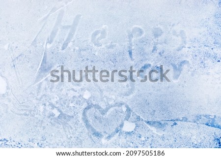 text happy new year written on ice for skating on a winter day, Flatlay, horizontal
