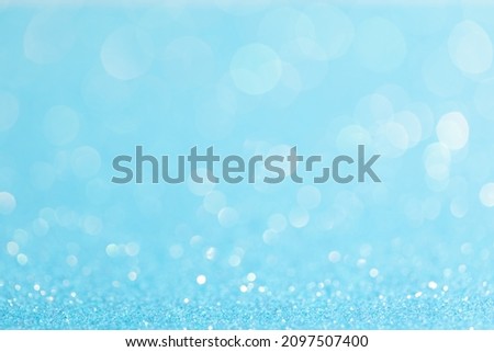sparkles of Blue glitter abstract background. Copy space