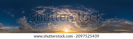 Dark blue sunset sky pano with Cumulus clouds. Seamless hdr panorama in spherical equirectangular format. Complete zenith for 3D visualization, game and sky replacement for aerial drone 360 panoramas. Royalty-Free Stock Photo #2097525439