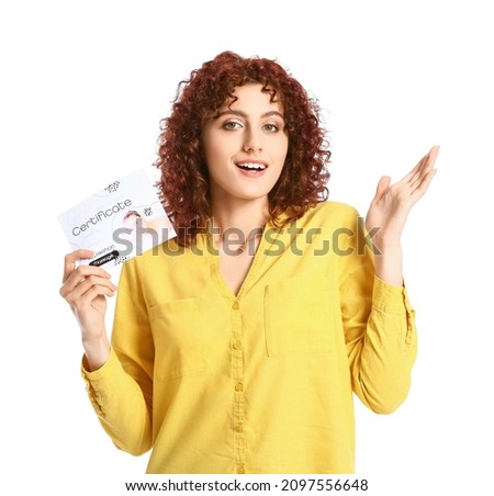 Pretty young woman with gift certificate on white background