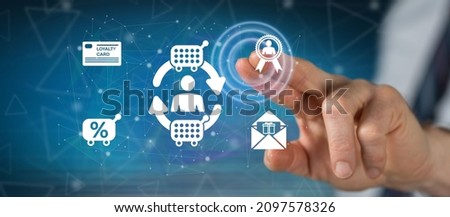 Man touching a customer loyalty concept on a touch screen with his finger Royalty-Free Stock Photo #2097578326