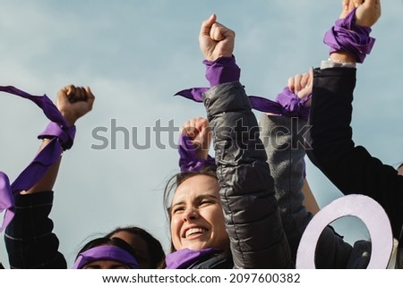 International Women's day, march 8 : Feminist protest with women expressing empowerment and leadership to achieve woman's rights Royalty-Free Stock Photo #2097600382