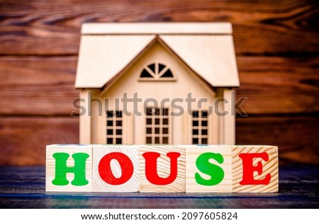 Wooden home and text on the cubes house