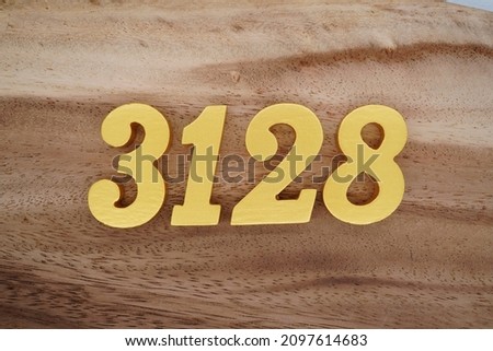 Golden Arabic numerals 3128 on a dark brown to white wood grain background.