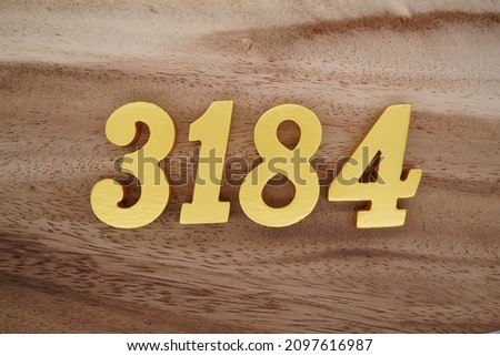 Golden Arabic numerals 3184 on a dark brown to white wood grain background.
