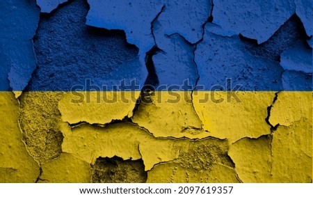 Flag of Ukraine on old grunge wall in background  Royalty-Free Stock Photo #2097619357
