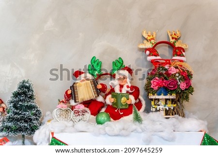 santa claus doll, santa claus statue with christmas decorations and gifts. christmas decorations for new year celebration