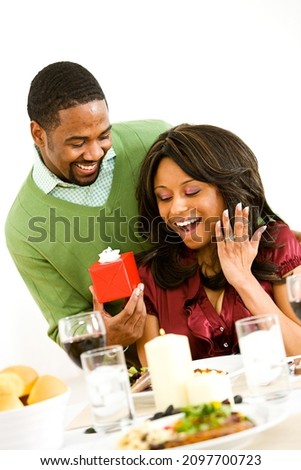 Extensive series with a young African-American couple having a romantic dinner.